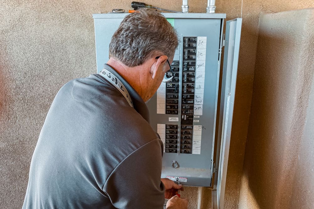 home inspector checking the electrical panel