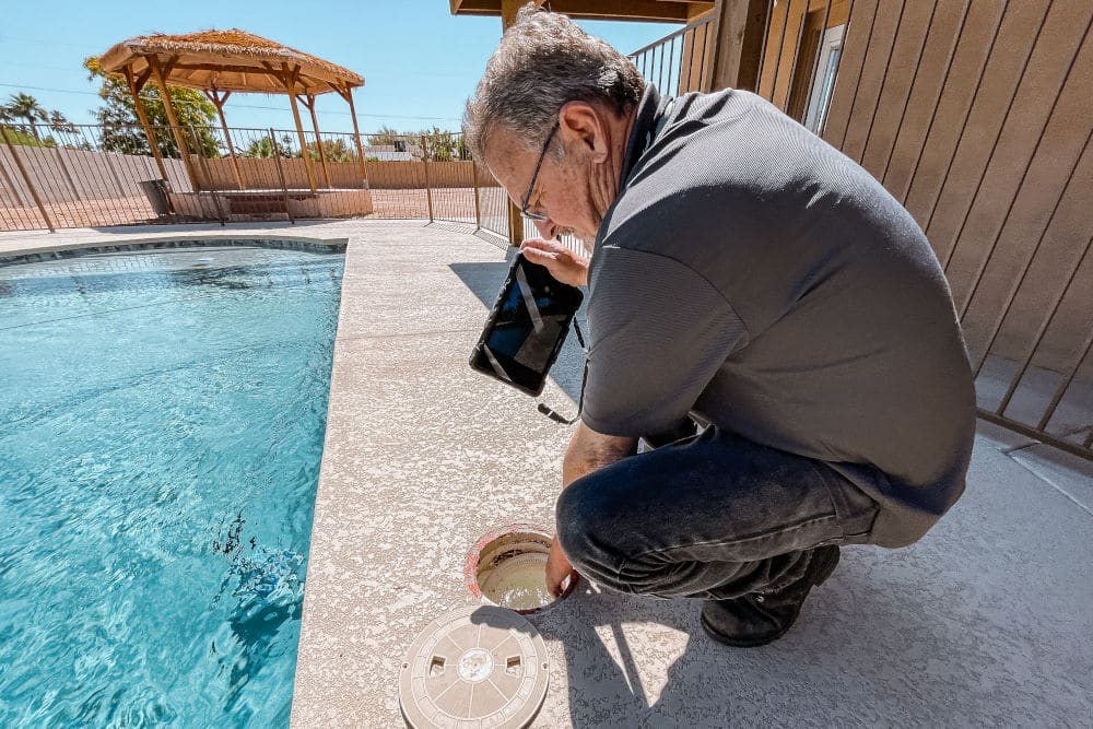 home inspector jeff hunter inspecting pool equipment