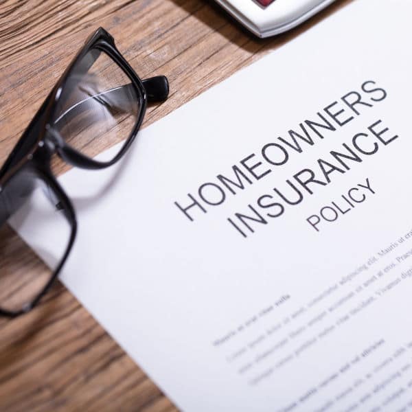 Person Filling Homeowners Insurance Policy Form